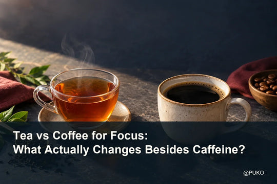 Tea and coffee cups on a warm editorial tabletop with the title Tea vs Coffee for Focus: What Actually Changes Besides Caffeine? and @PUKO.