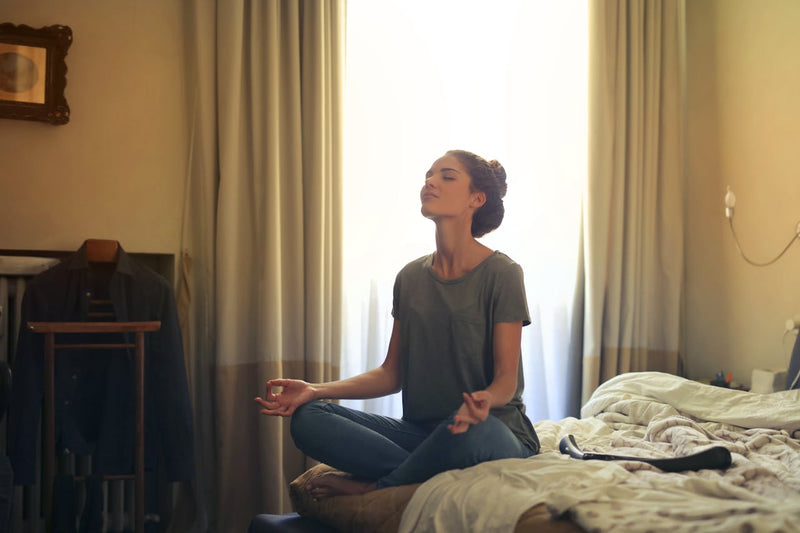 Person sitting calmly with eyes closed — magnesium glycinate for everyday stress