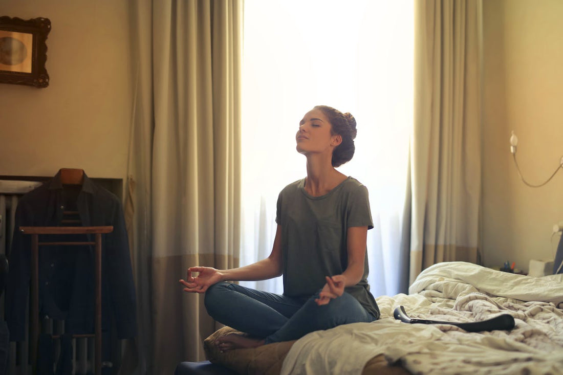 Person sitting calmly with eyes closed — magnesium glycinate for everyday stress