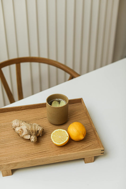 A warm cup of herbal tea on a wooden tray — ashwagandha powder vs tea vs capsules