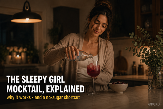 Woman making a sleepy girl mocktail with tart cherry juice in a cozy evening kitchen