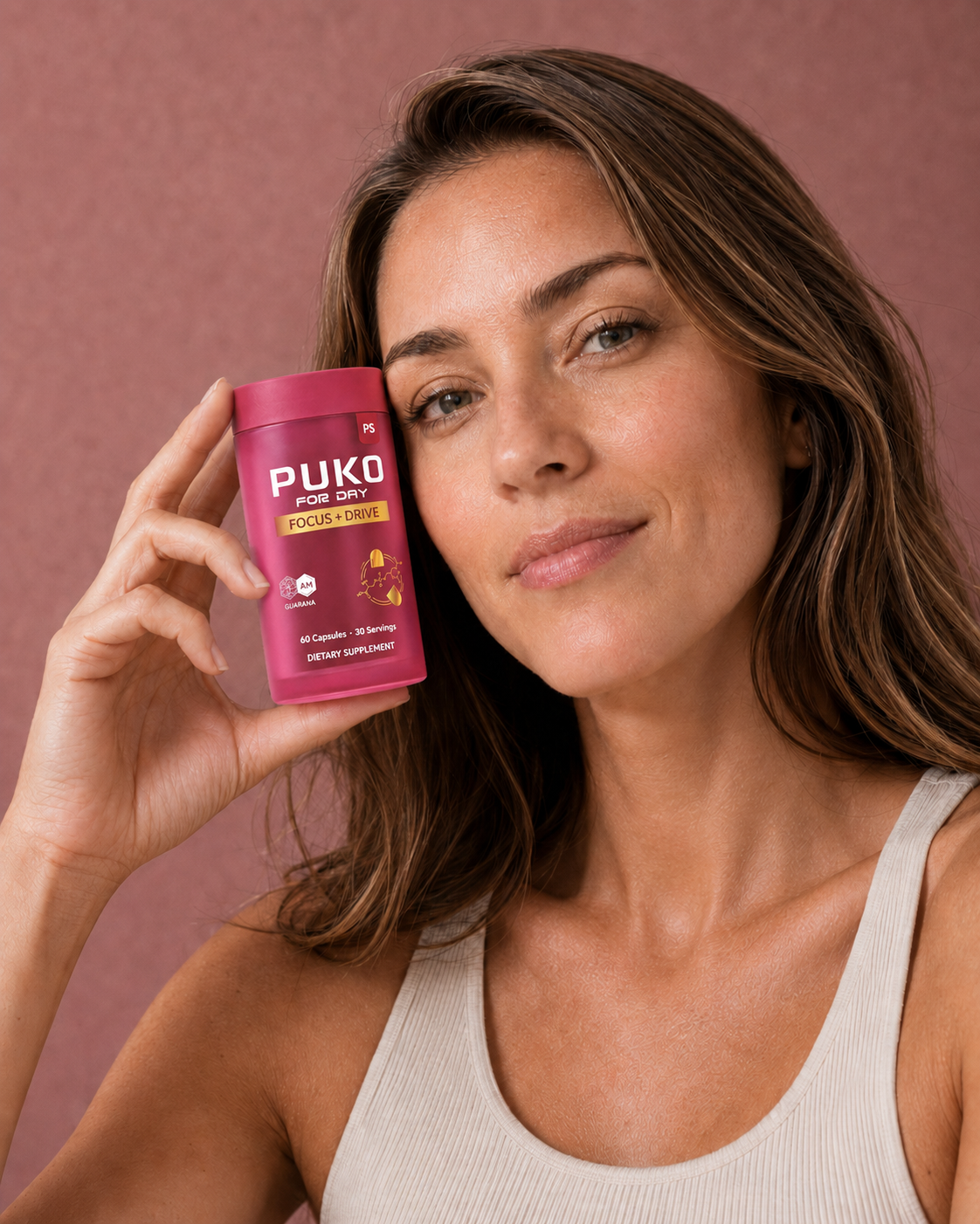 Woman holding a PUKO Focus + Drive supplement bottle.